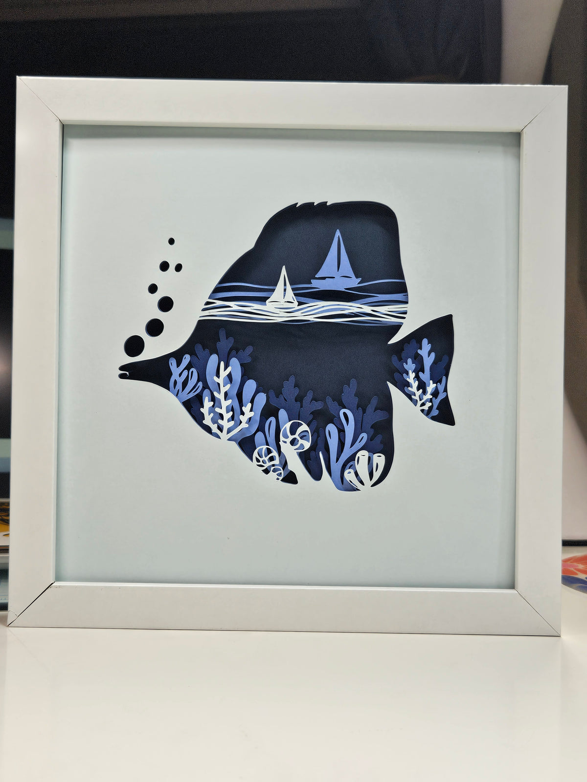 Tang Fish with coral and sail boats