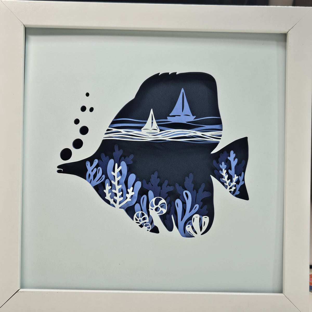 Tang Fish with coral and sail boats