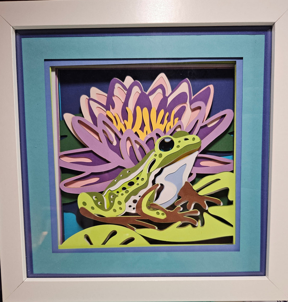 Frog on a Lily pad with flower